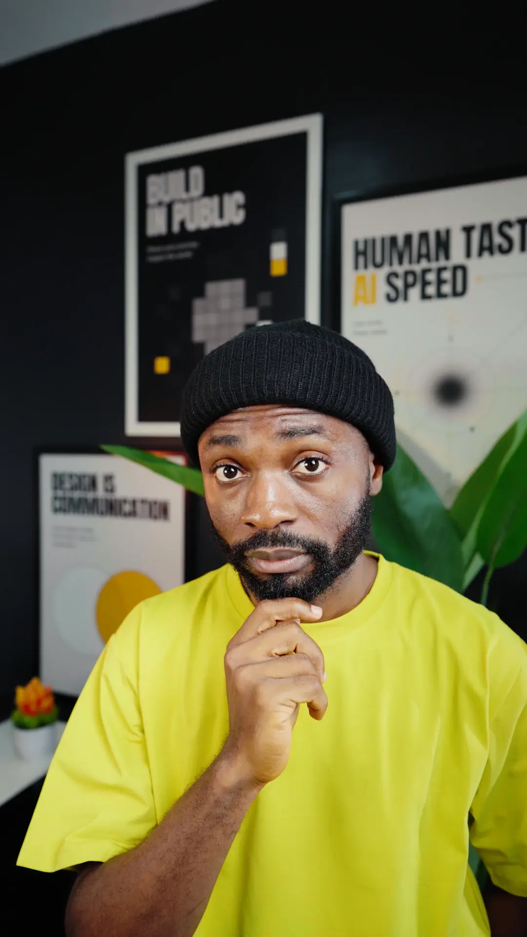 Hyginus wearing a yellow shirt in his studio for a video about restarting web design in 2026